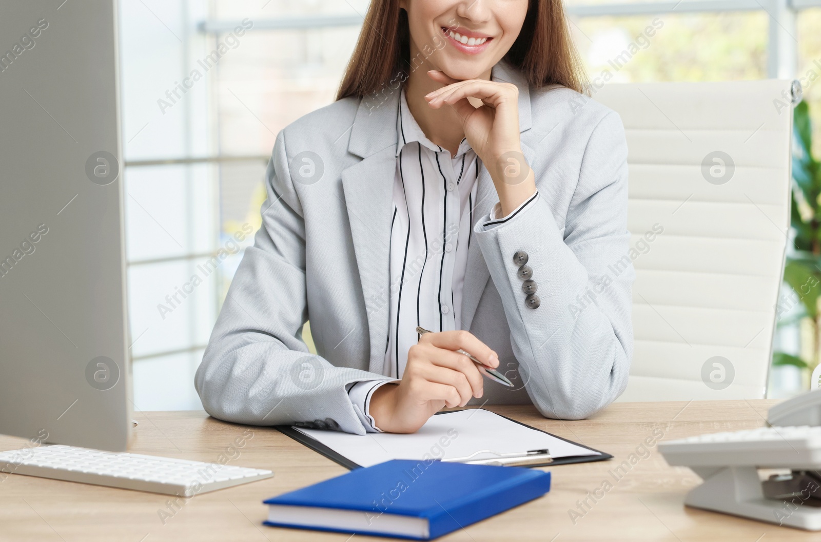 Photo of Banker working at wooden table in office, closeup