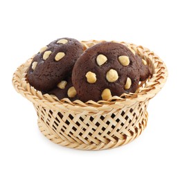 Photo of Tasty chocolate cookies with hazelnuts in wicker basket isolated on white