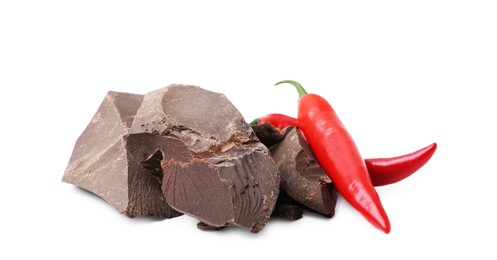 Photo of Pieces of tasty chocolate with chili peppers isolated on white