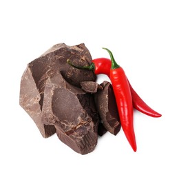 Photo of Pieces of tasty chocolate with chili peppers isolated on white, top view