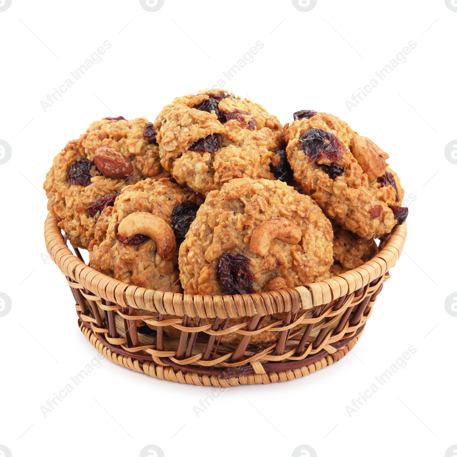 Photo of Delicious oatmeal cookies with dried cranberries and nuts in wicker basket isolated on white