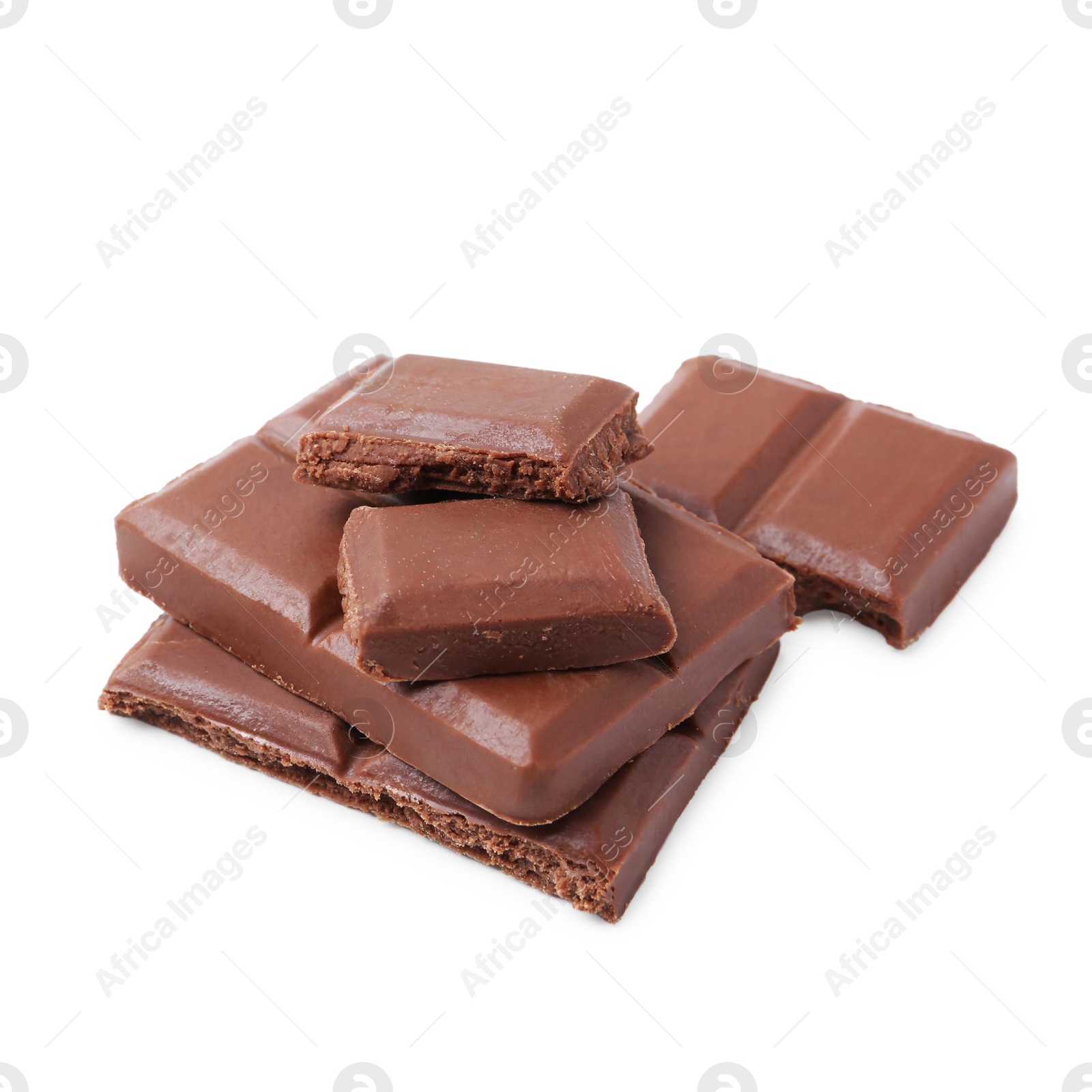 Photo of Pieces of delicious milk chocolate isolated on white