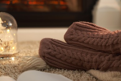 Woman in knitted socks resting at home, closeup