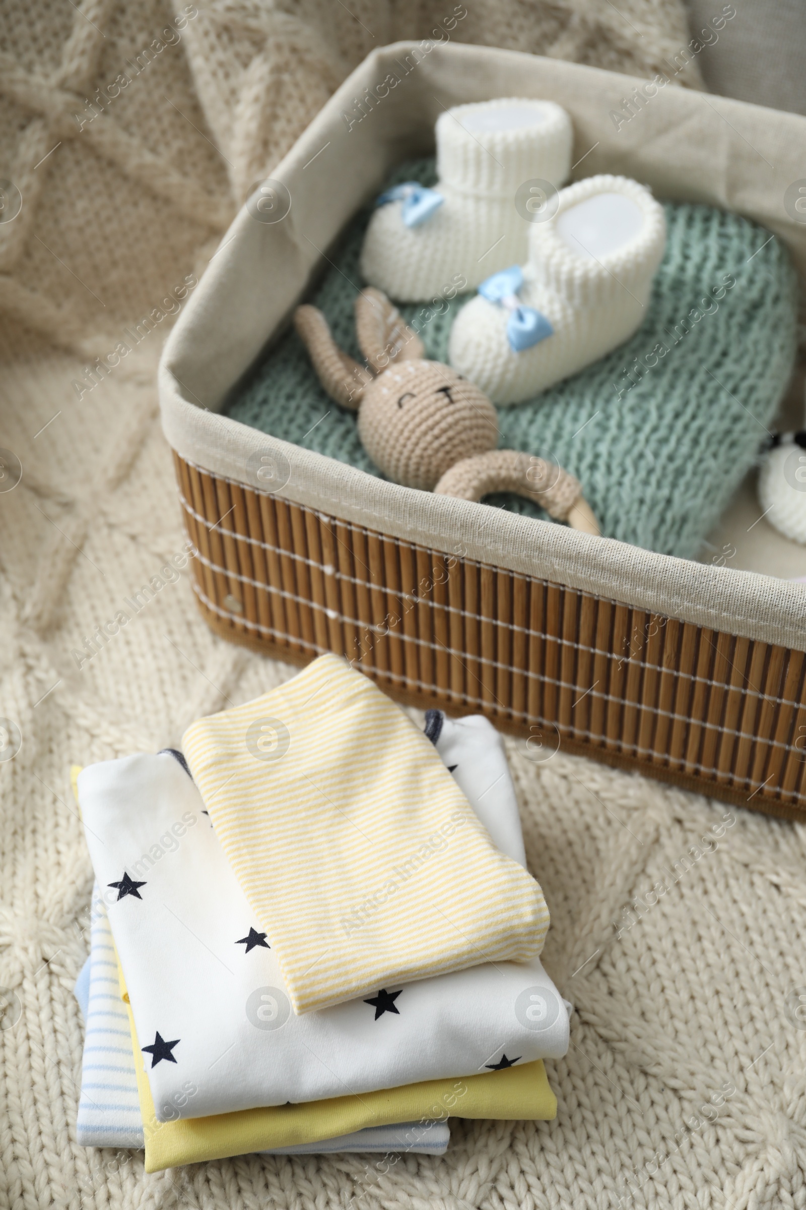 Photo of Baby clothes on sofa at home, closeup