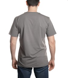 Photo of Man in blank grey t-shirt on white background, back view. Mockup for design