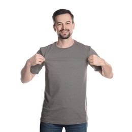 Photo of Man in blank grey t-shirt on white background. Mockup for design