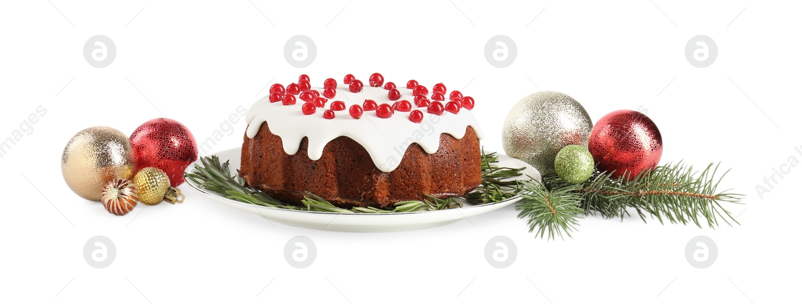 Photo of Tasty Christmas cake with red currants, rosemary, fir branches and baubles isolated on white