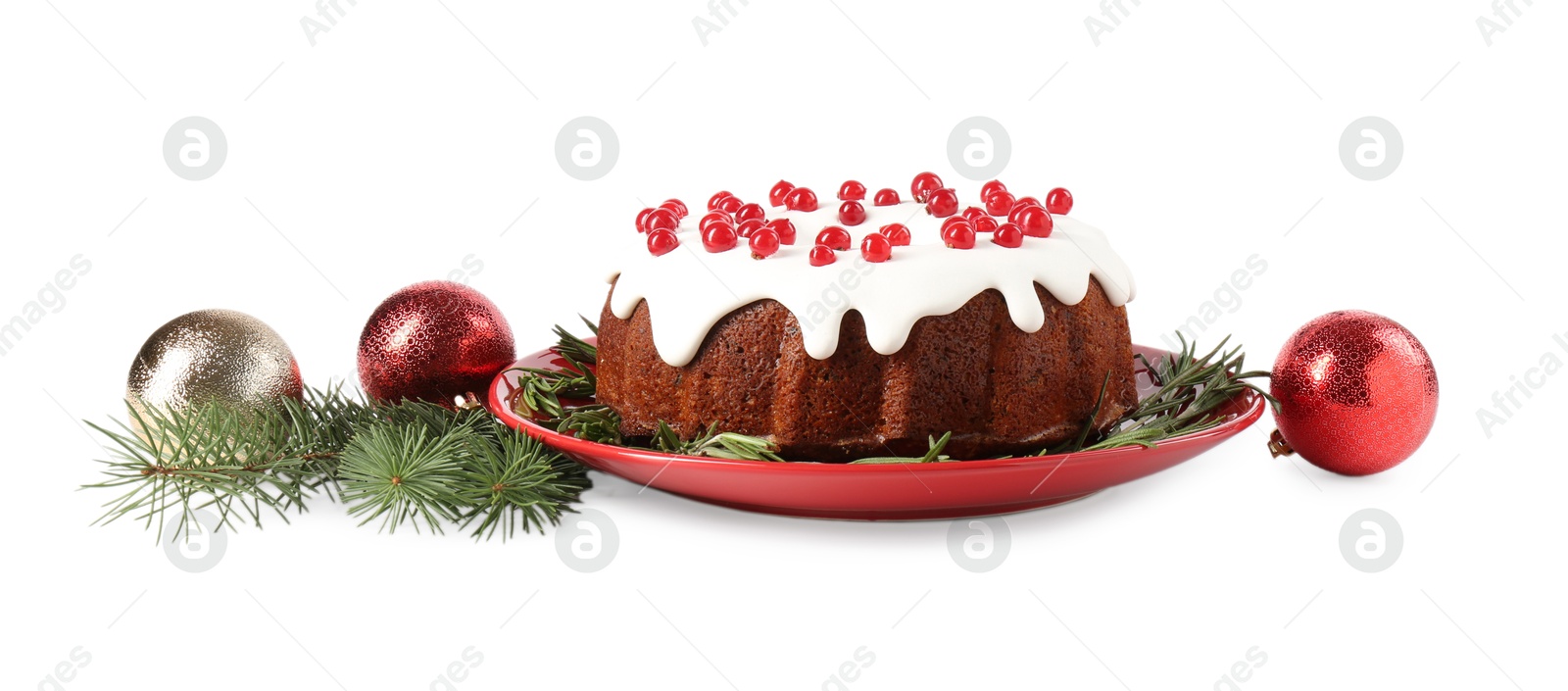 Photo of Tasty Christmas cake with red currants, rosemary, fir branches and baubles isolated on white