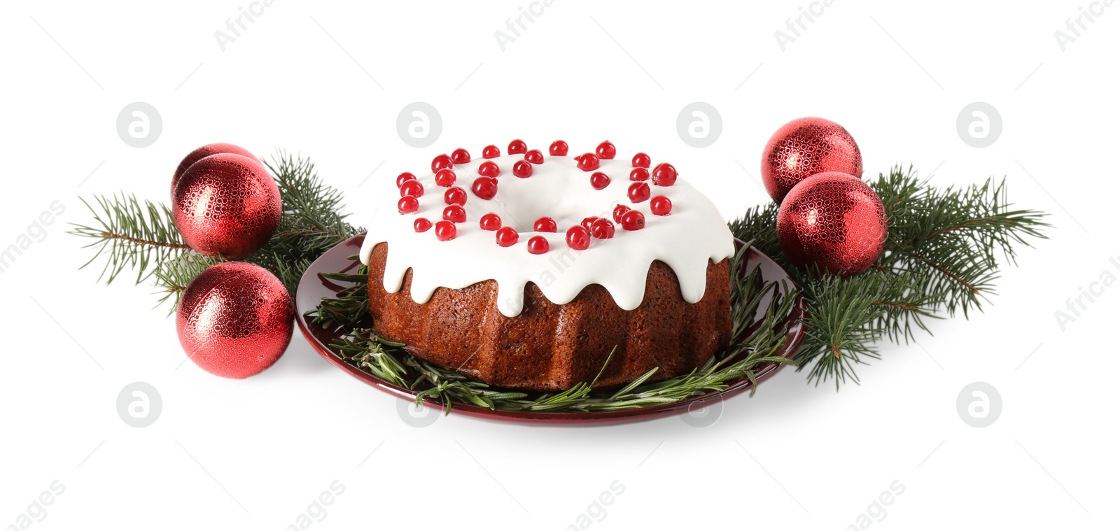 Photo of Tasty Christmas cake with red currants, rosemary, fir branches and baubles isolated on white