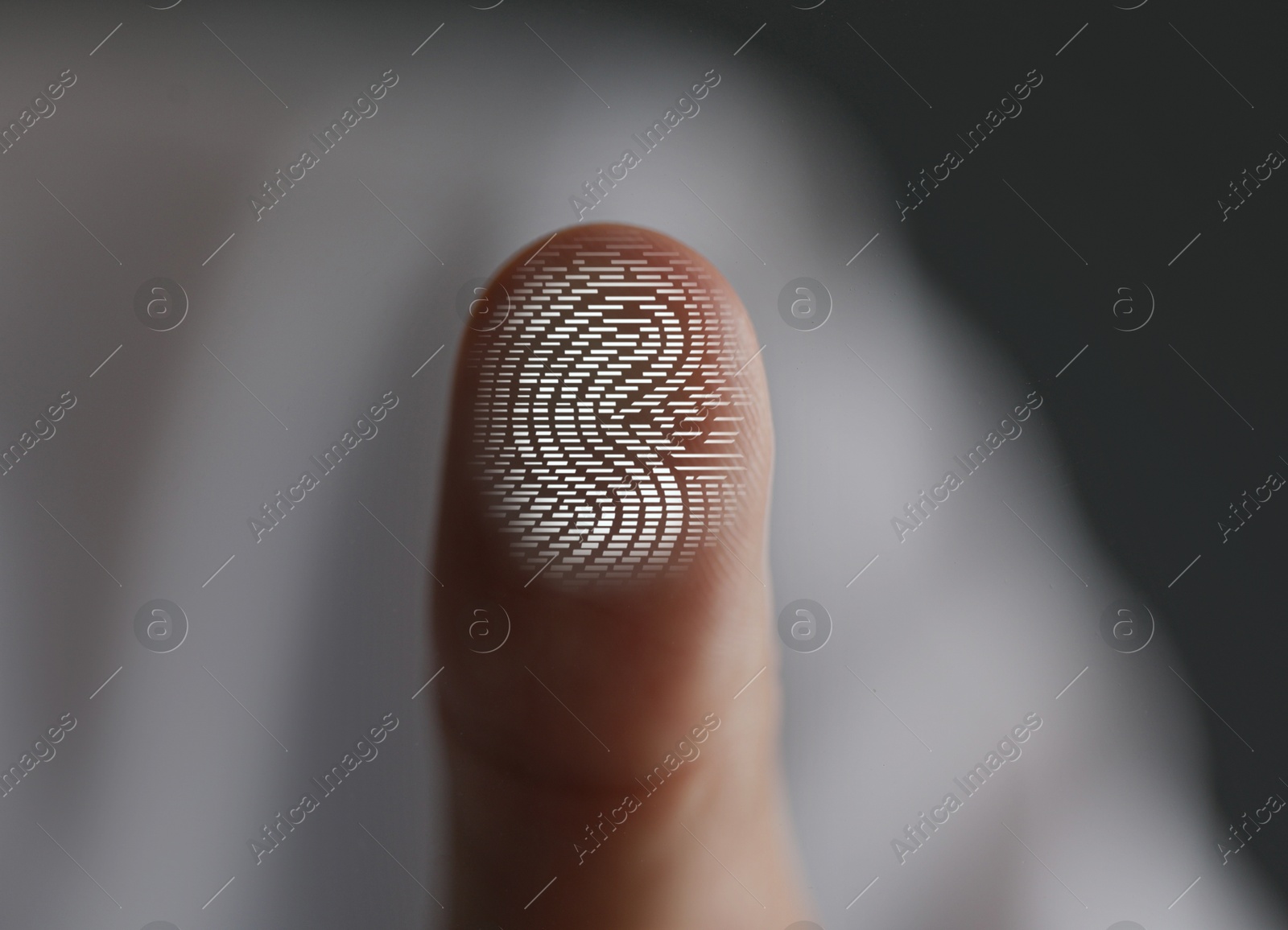 Image of Man pressing finger to surface showing friction ridges pattern, closeup. Scanning fingerprint