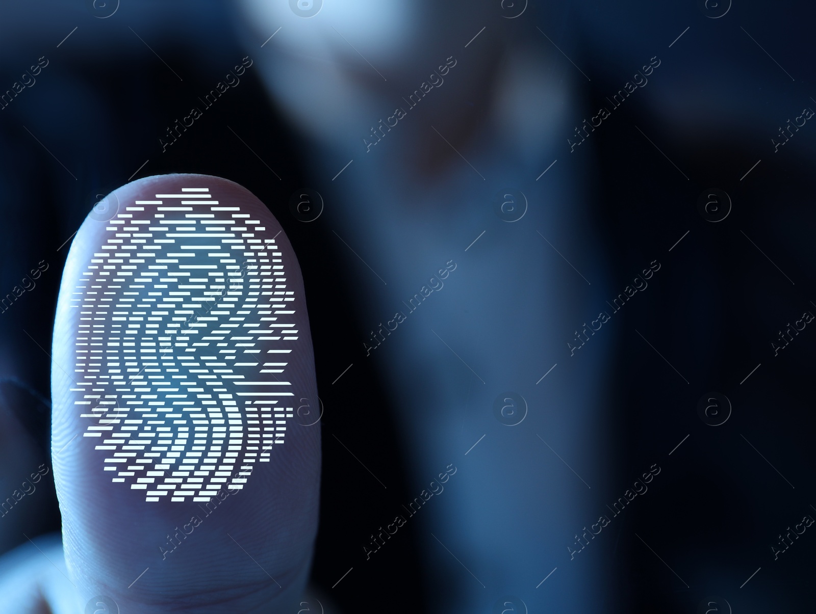 Image of Woman pressing finger to surface showing friction ridges pattern, closeup. Scanning fingerprint