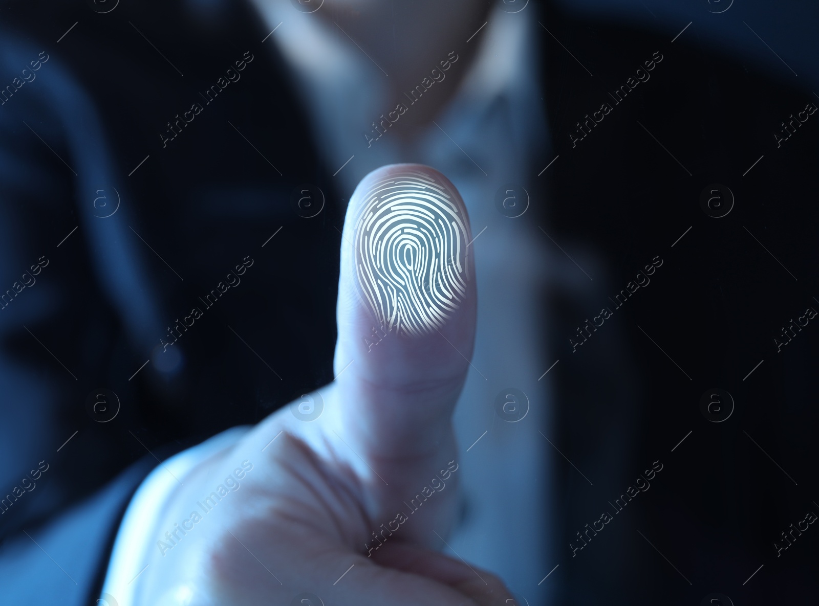 Image of Woman pressing finger to surface showing friction ridges pattern, closeup. Scanning fingerprint