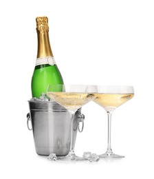 Photo of Champagne and bucket with ice isolated on white