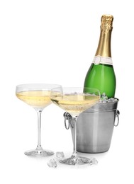 Photo of Champagne and bucket with ice isolated on white