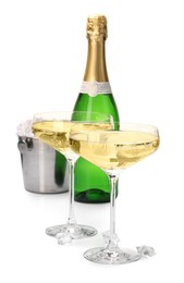 Photo of Champagne and bucket with ice isolated on white