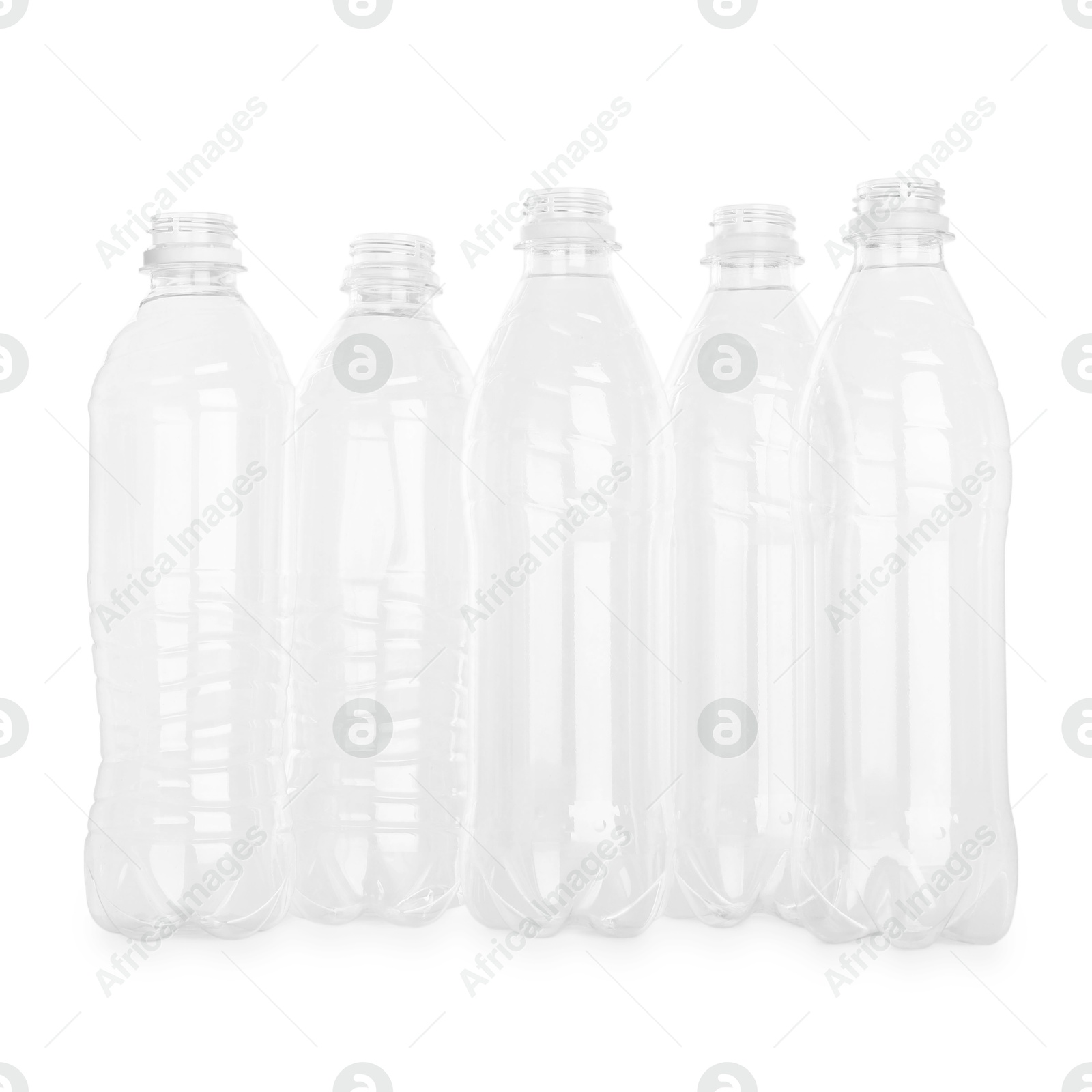 Photo of Many empty plastic bottles isolated on white