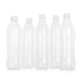 Photo of Many empty plastic bottles isolated on white