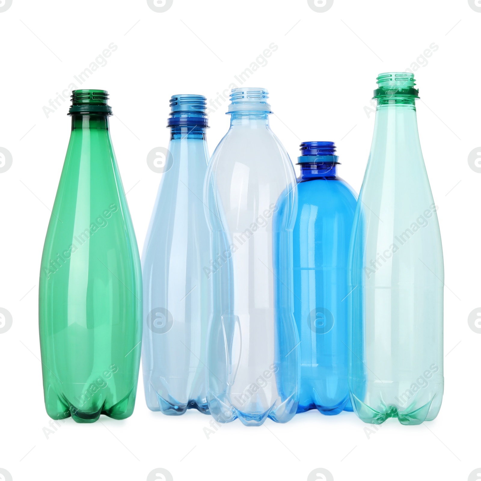 Photo of Many empty plastic bottles isolated on white