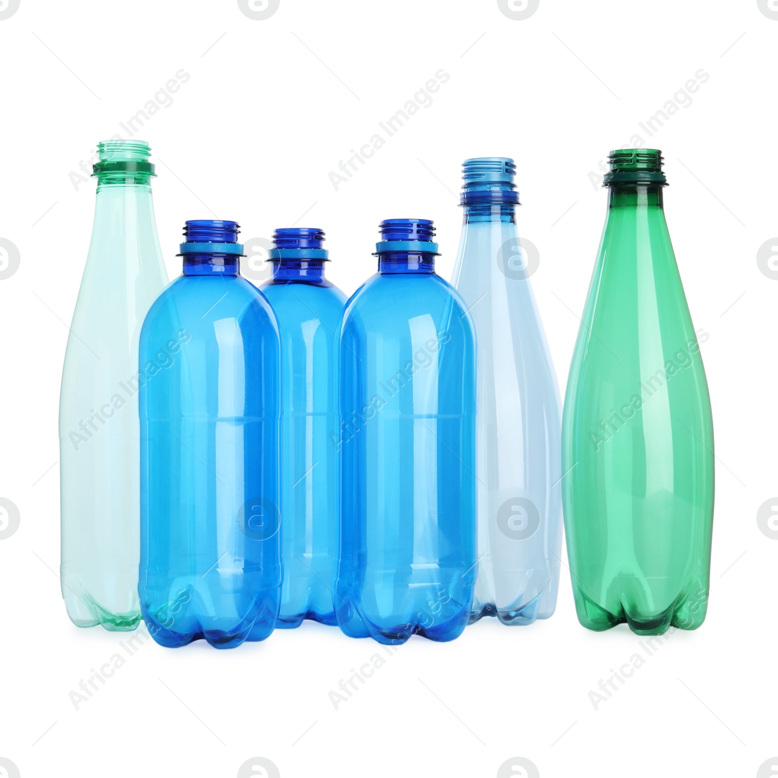 Photo of Many empty plastic bottles isolated on white