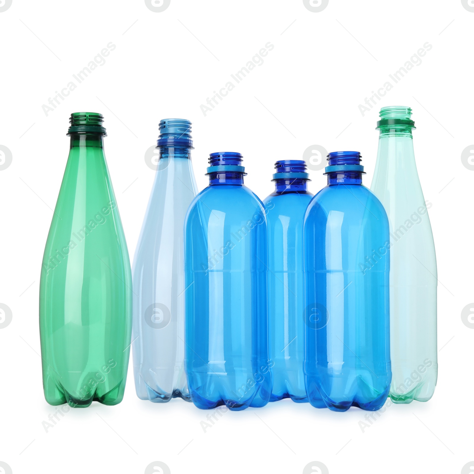 Photo of Many empty plastic bottles isolated on white