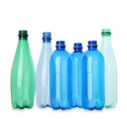 Photo of Many empty plastic bottles isolated on white