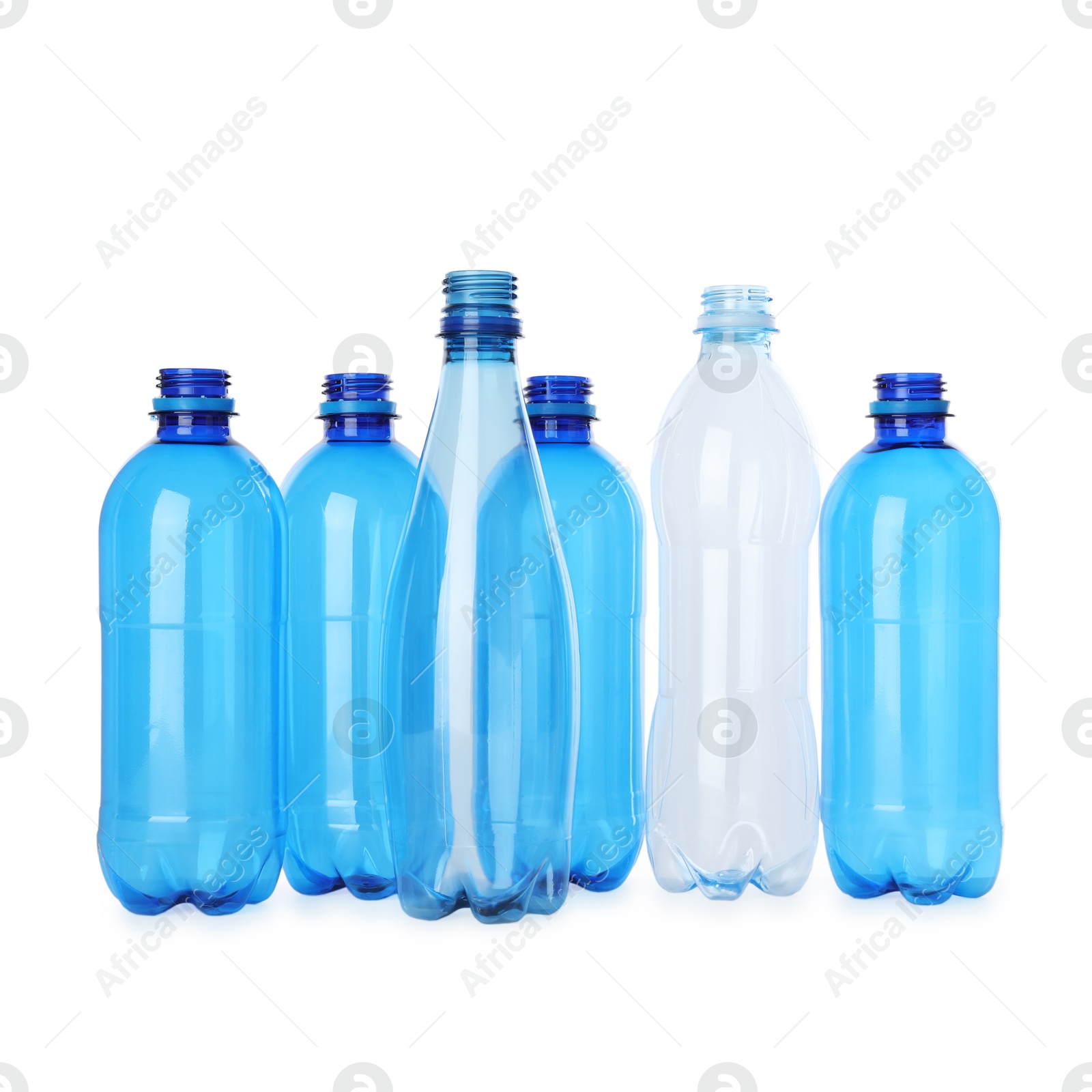 Photo of Many empty plastic bottles isolated on white