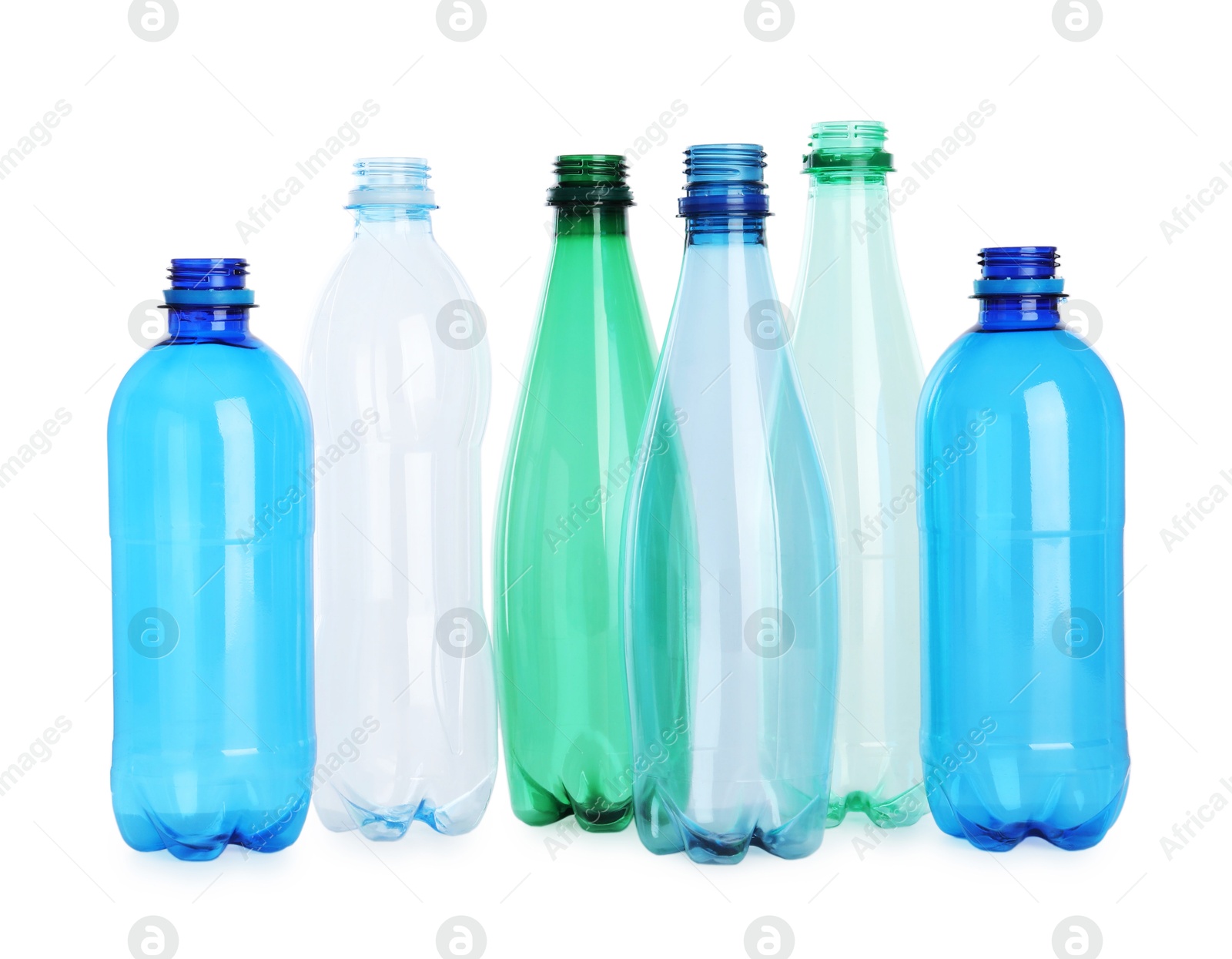 Photo of Many empty plastic bottles isolated on white