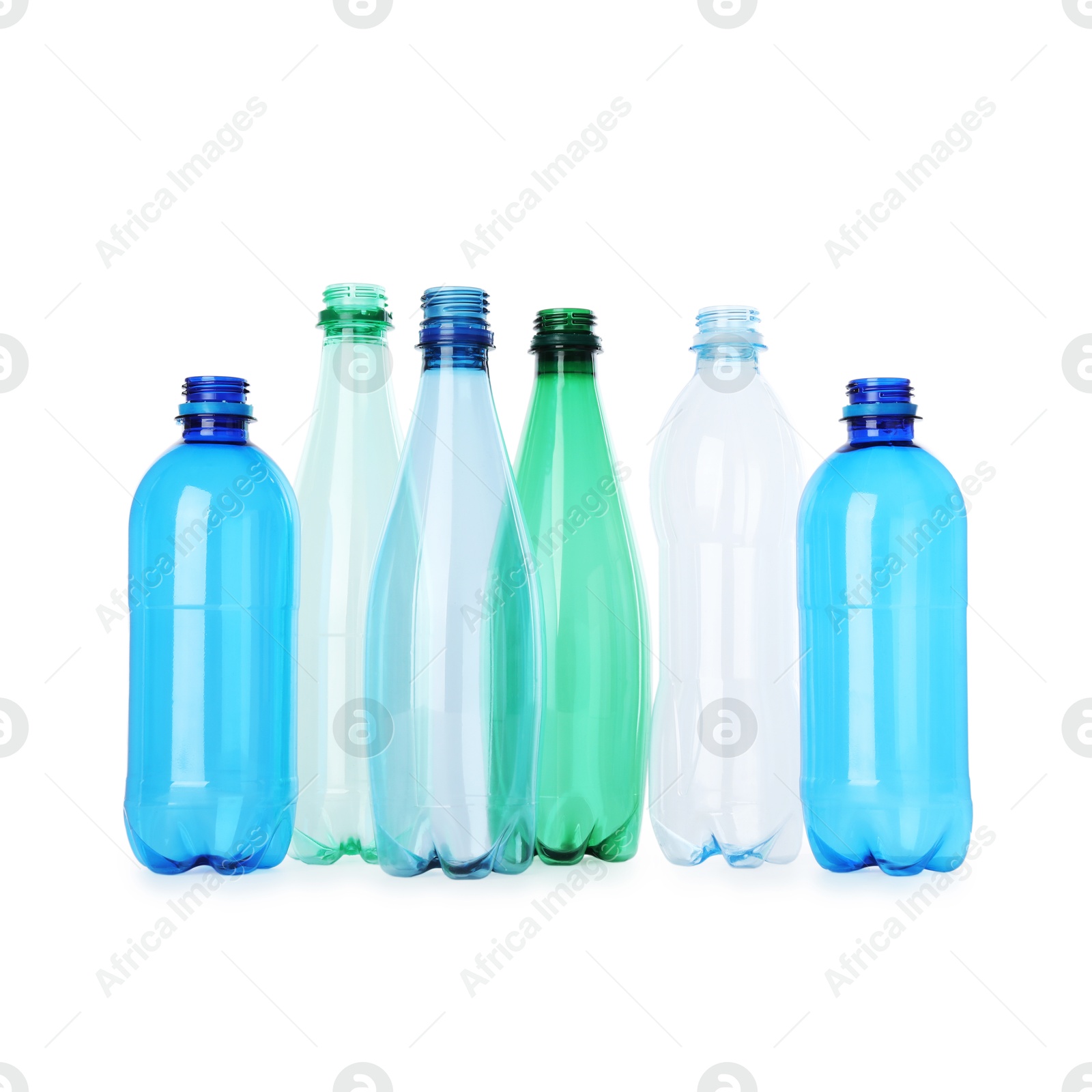 Photo of Many empty plastic bottles isolated on white