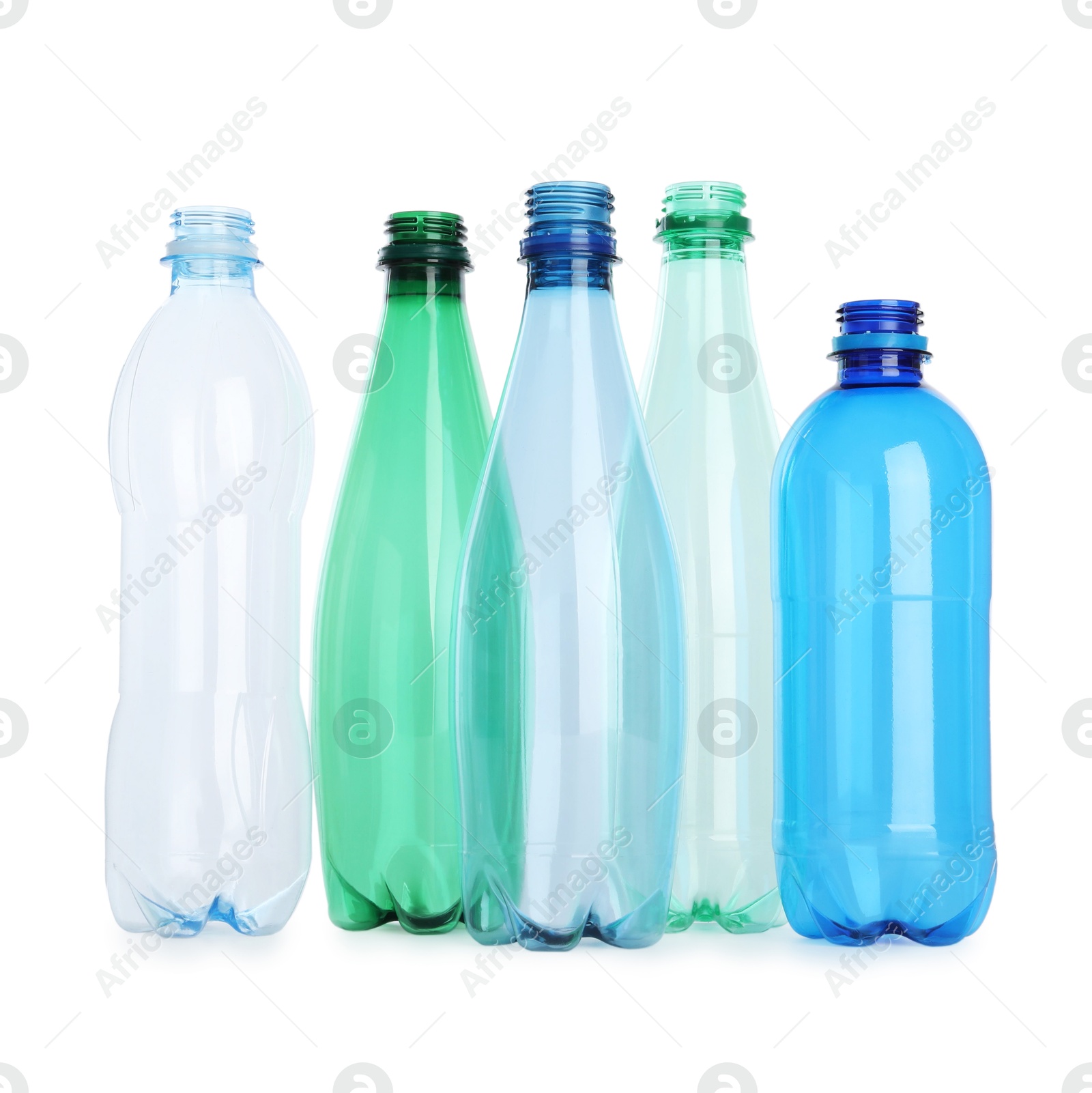 Photo of Many empty plastic bottles isolated on white