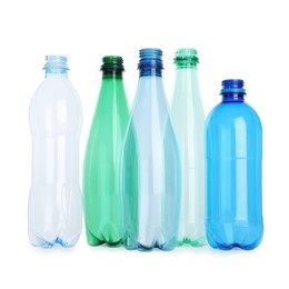 Photo of Many empty plastic bottles isolated on white