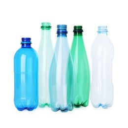 Photo of Many empty plastic bottles isolated on white