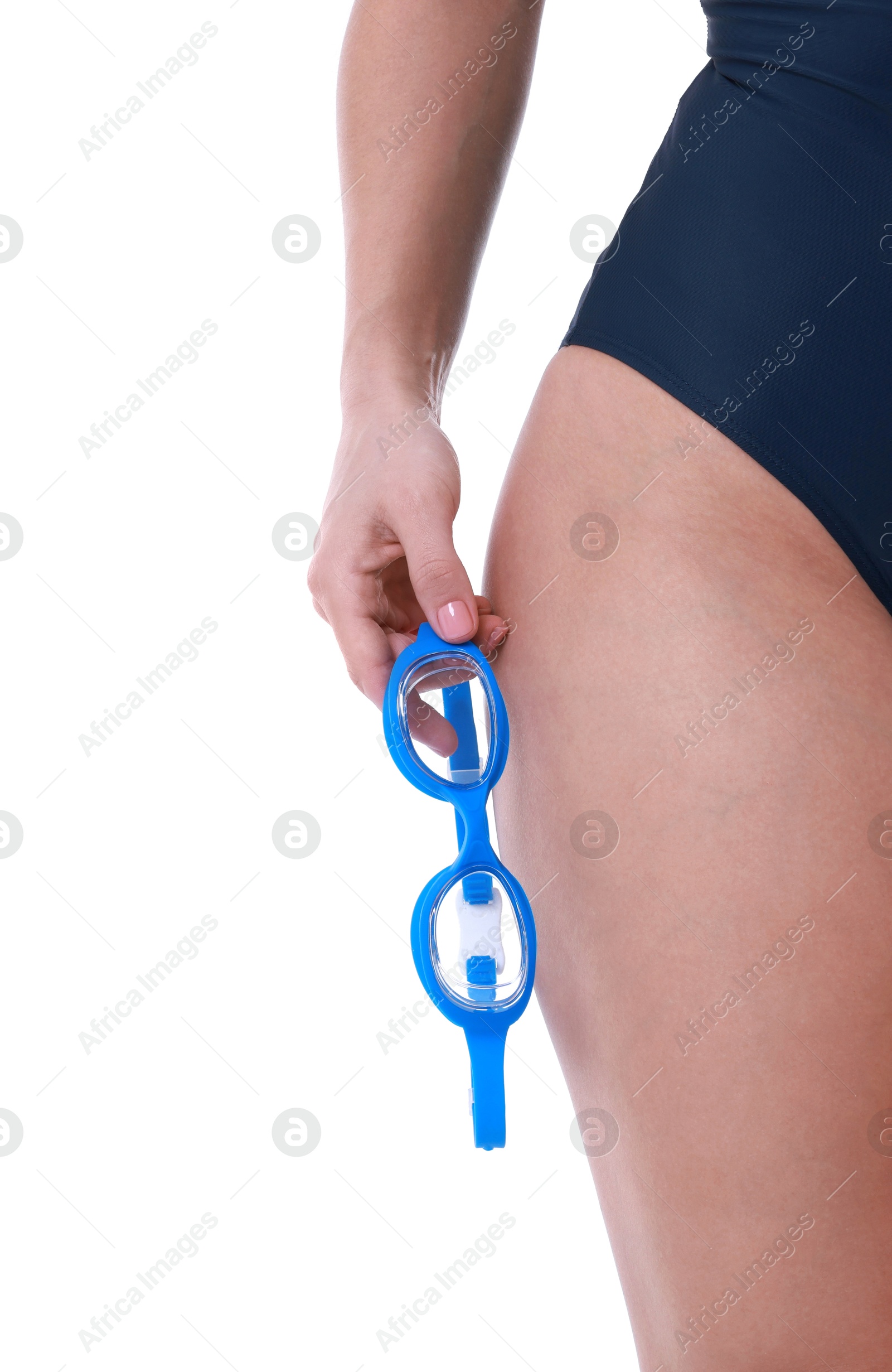 Photo of Professional sportswoman in swimsuit with swimming goggles on white background, closeup