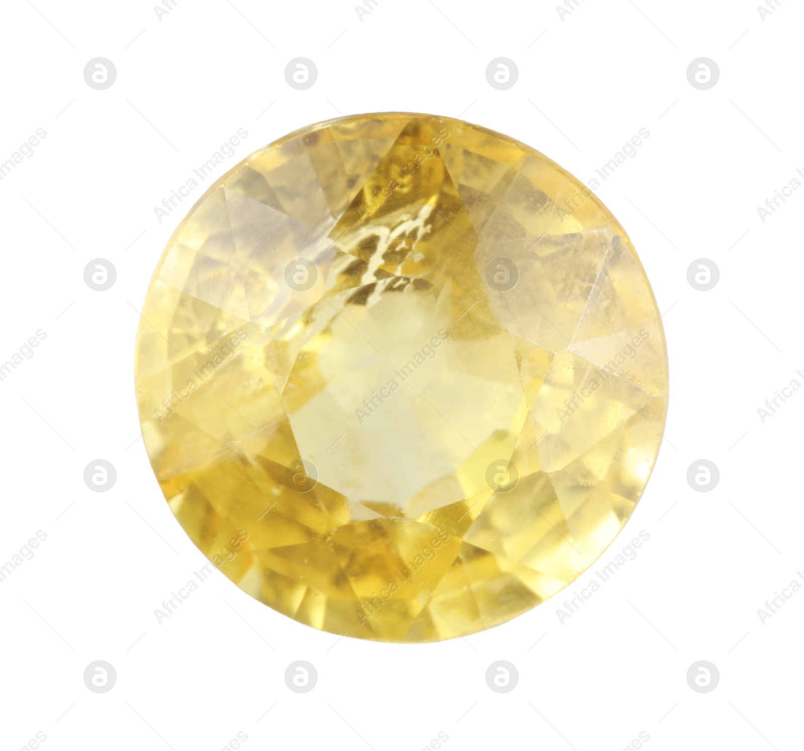 Photo of One shiny yellow gemstone isolated on white, top view