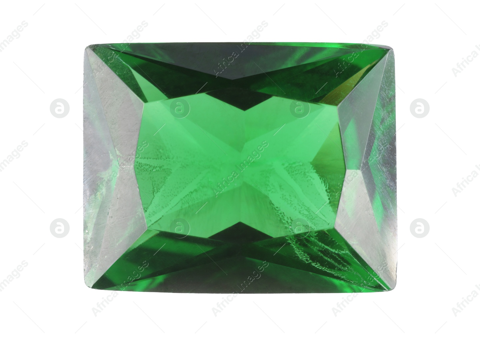 Photo of One shiny green gemstone isolated on white, top view