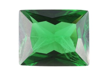 Photo of One shiny green gemstone isolated on white, top view