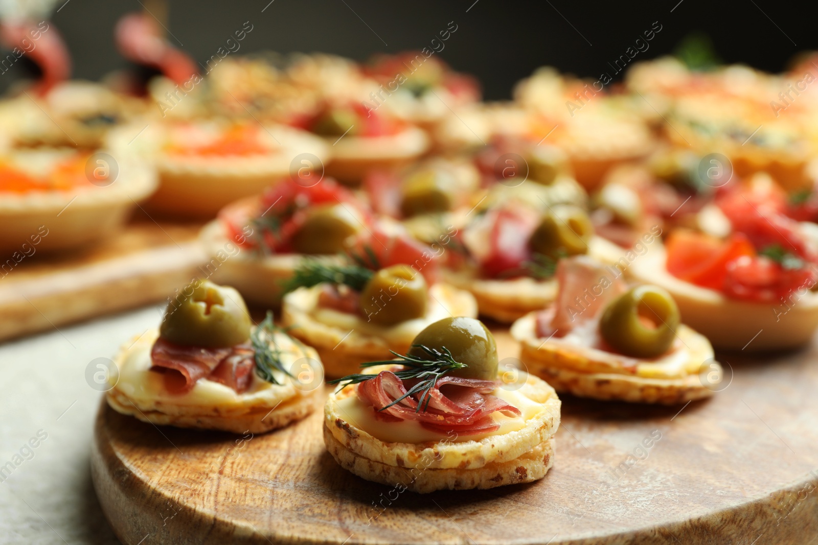 Photo of Many different tasty canapes on white table, closeup