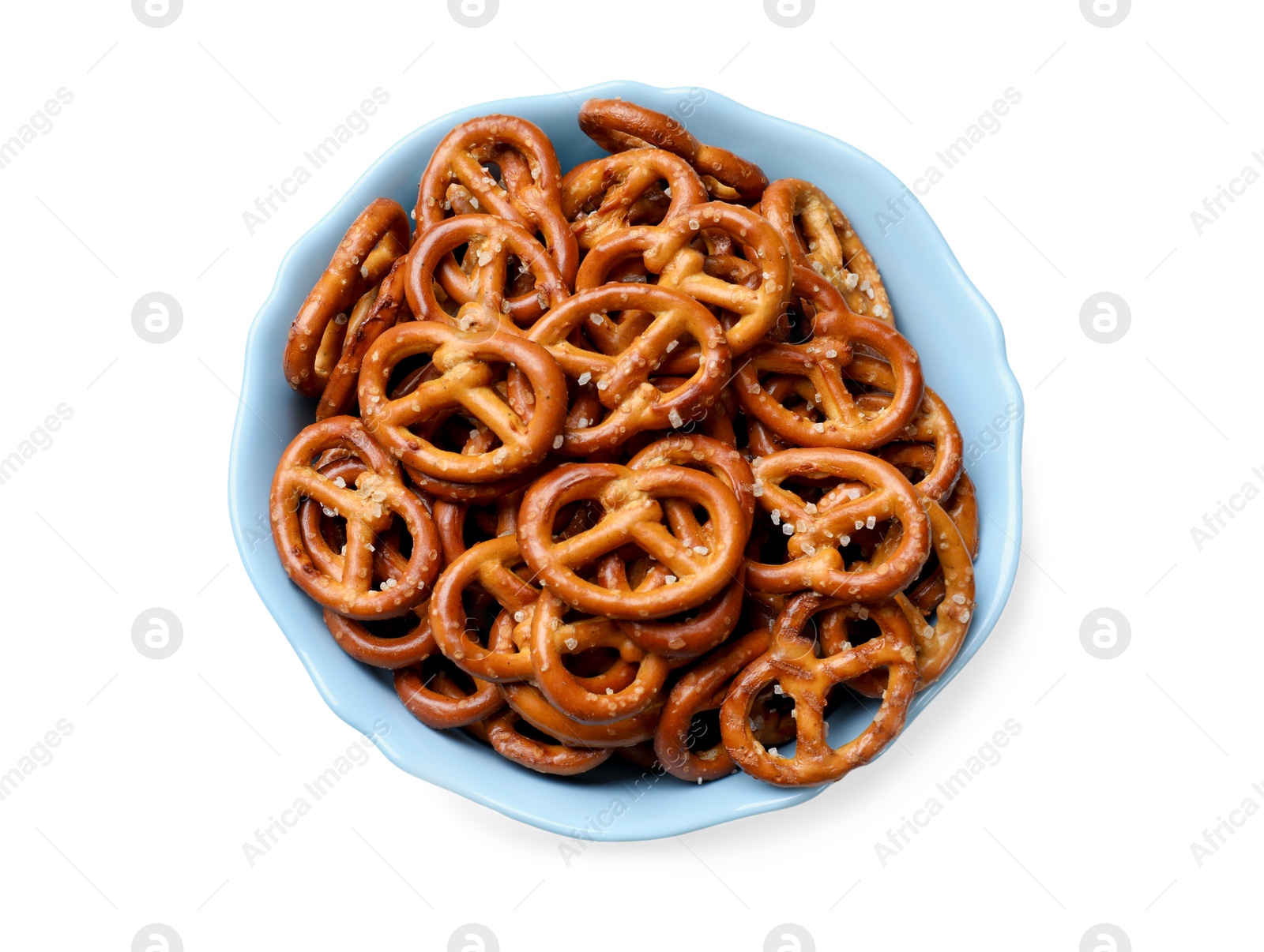 Photo of Tasty pretzel crackers in bowl isolated on white, top view