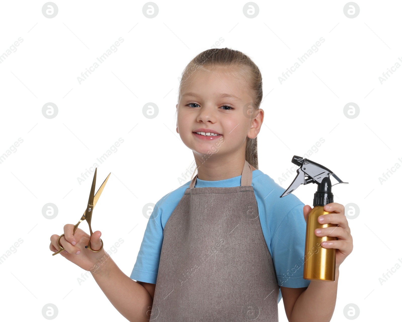 Photo of Little girl with scissors and sprayer pretending to be hairdresser on white background. Dreaming of future profession