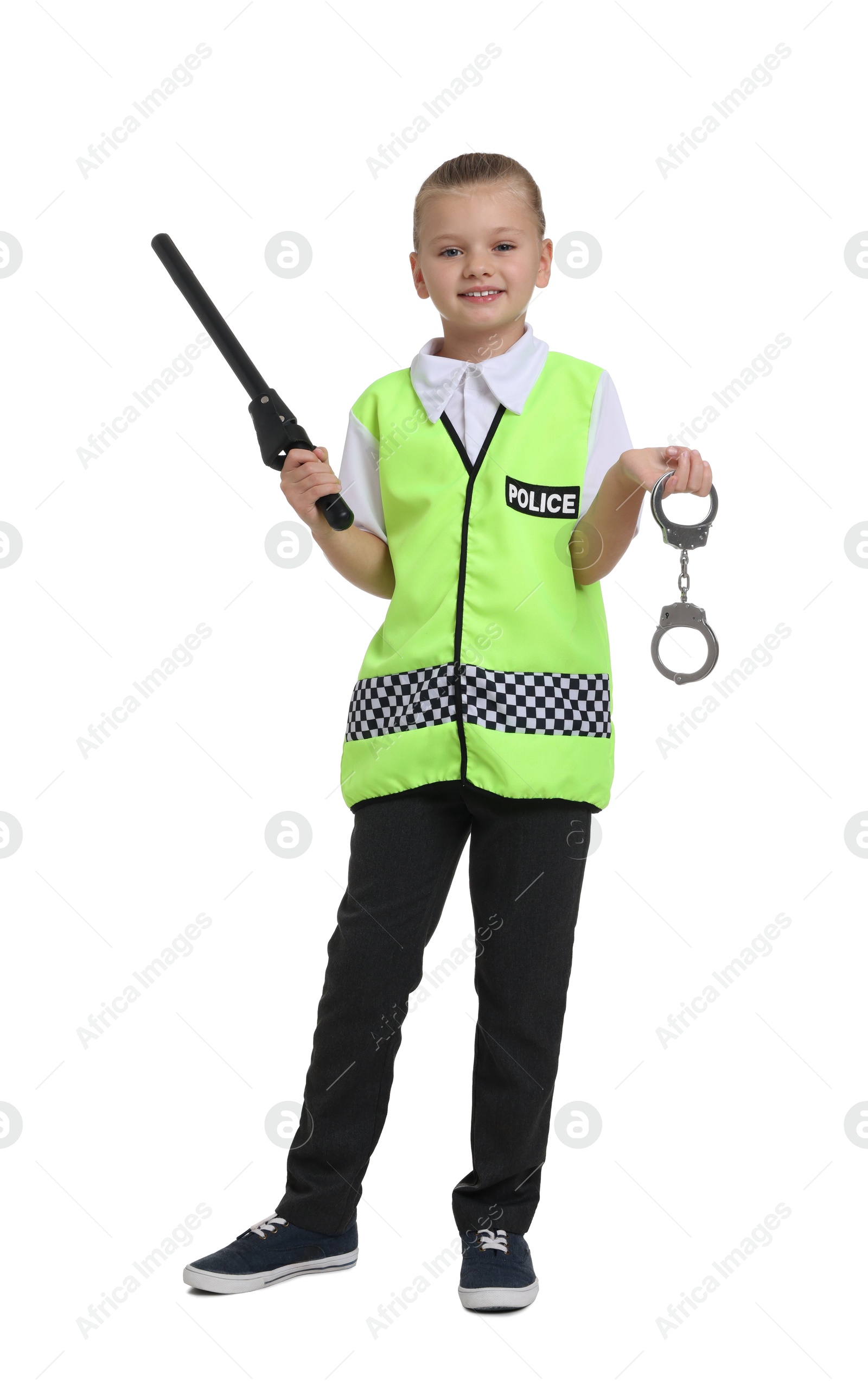 Photo of Little girl with baton and handcuffs pretending to be policewoman on white background. Dreaming of future profession