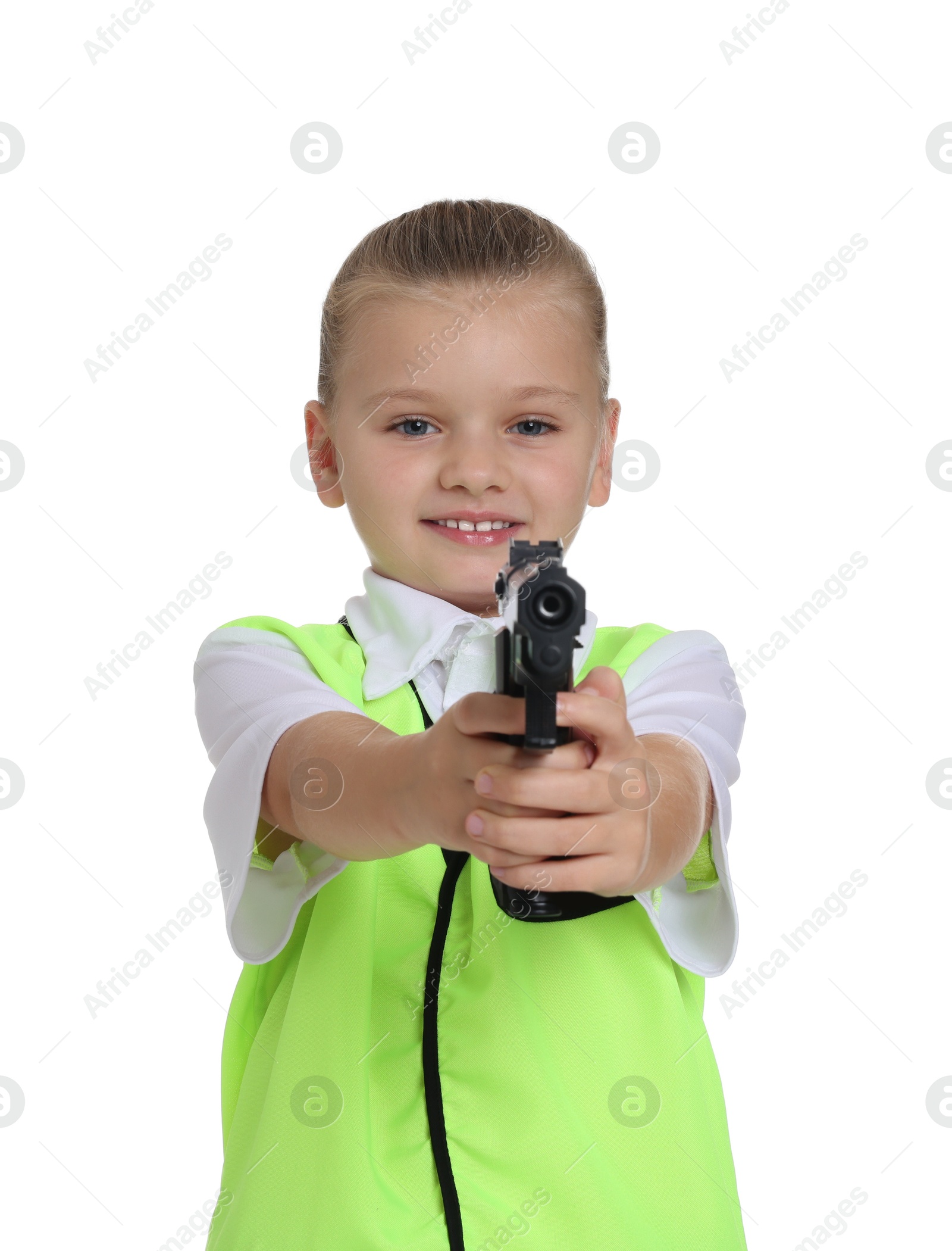 Photo of Little girl with gun pretending to be policewoman on white background. Dreaming of future profession