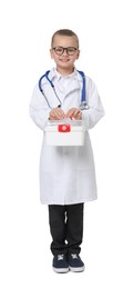 Photo of Little girl with stethoscope and first aid kit pretending to be doctor on white background. Dreaming of future profession