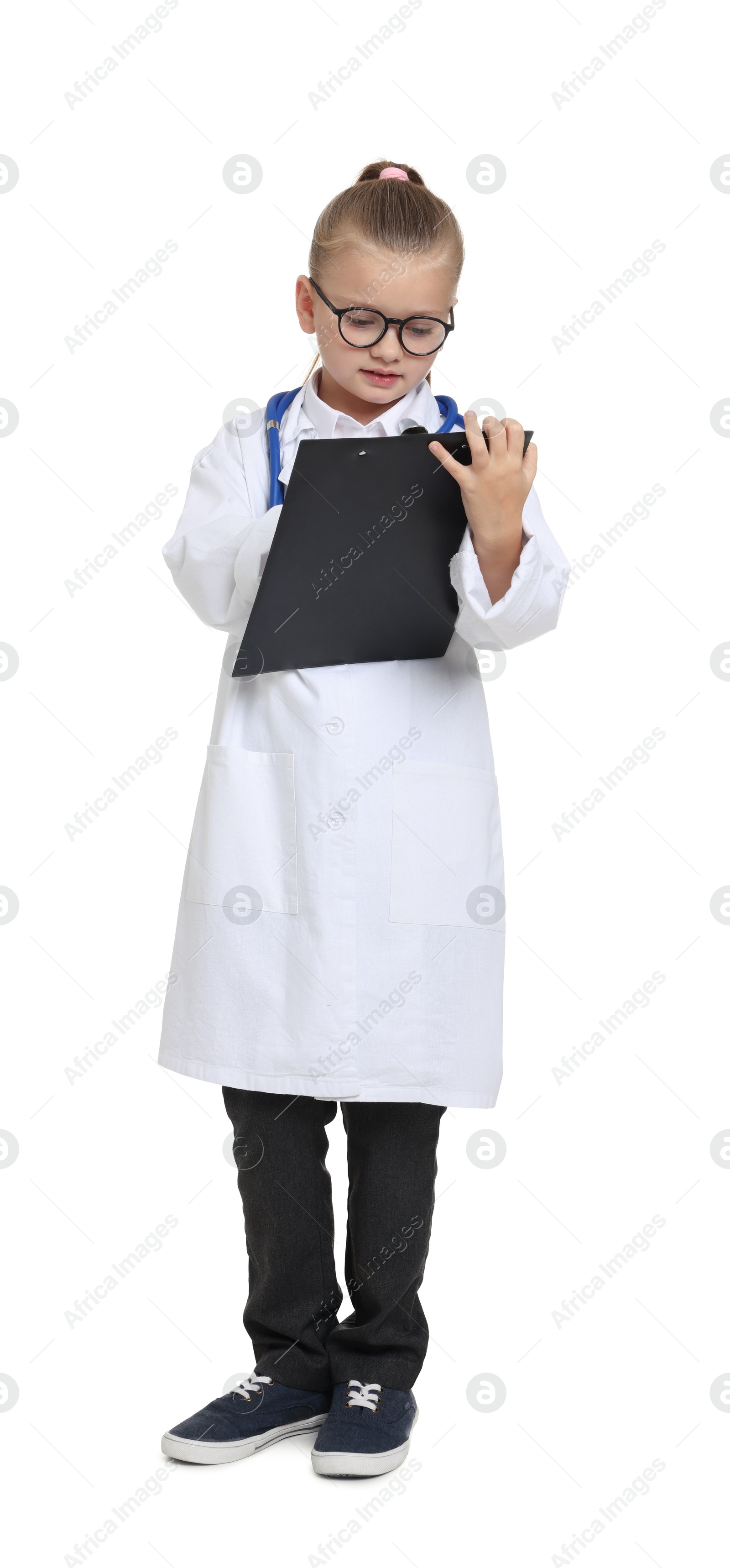 Photo of Little girl with stethoscope and clipboard pretending to be doctor on white background. Dreaming of future profession