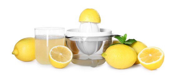 Photo of Juicer, fresh juice, lemons and mint isolated on white