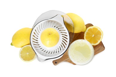 Photo of Fresh lemon juice in glass, juicer and fruits isolated on white, top view