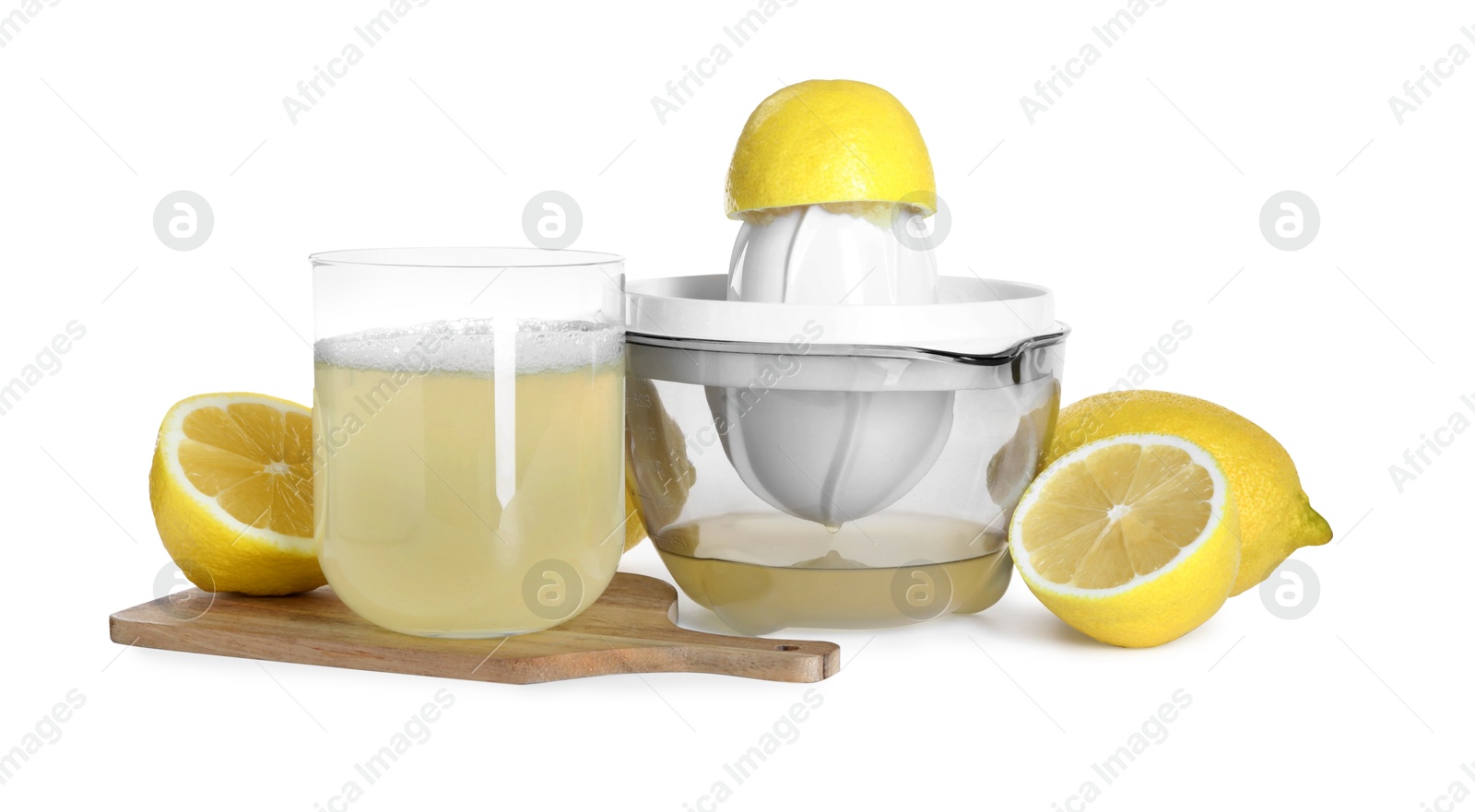 Photo of Fresh lemon juice in glass, juicer and fruits isolated on white