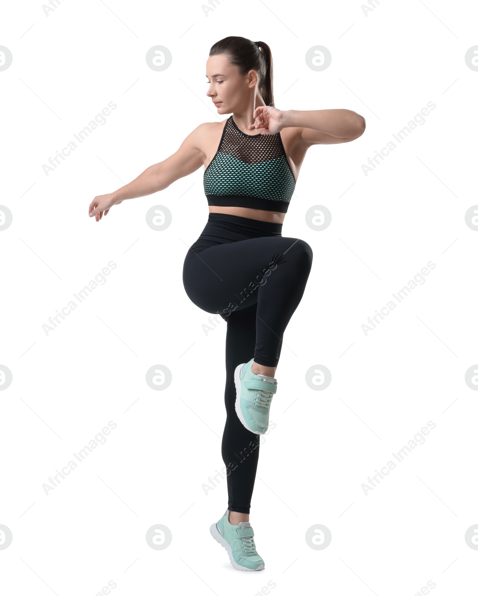 Photo of Beautiful woman in sportswear training on white background