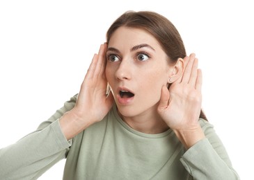 Photo of Woman showing hand to ear gesture on white background