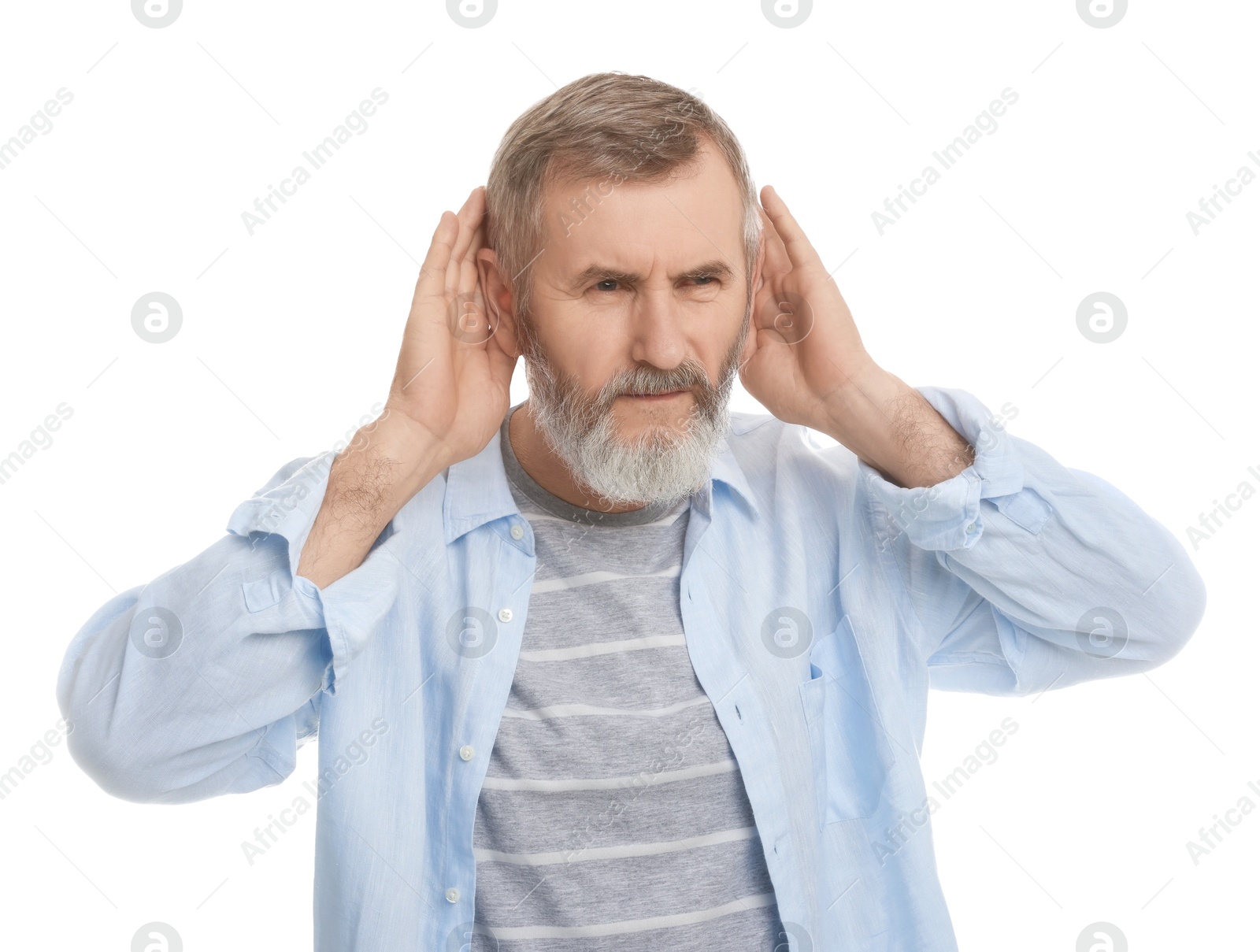 Photo of Senior man showing hand to ear gesture on white background