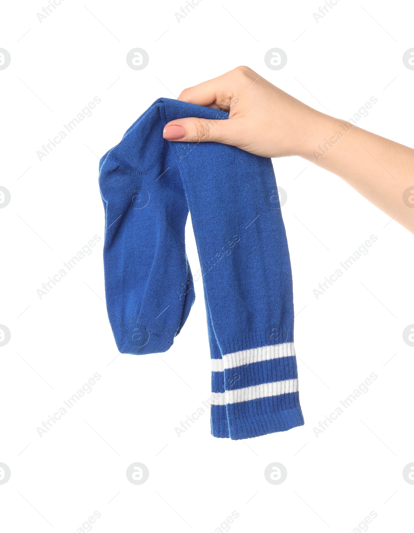 Photo of Woman holding pair of blue socks on white background, closeup