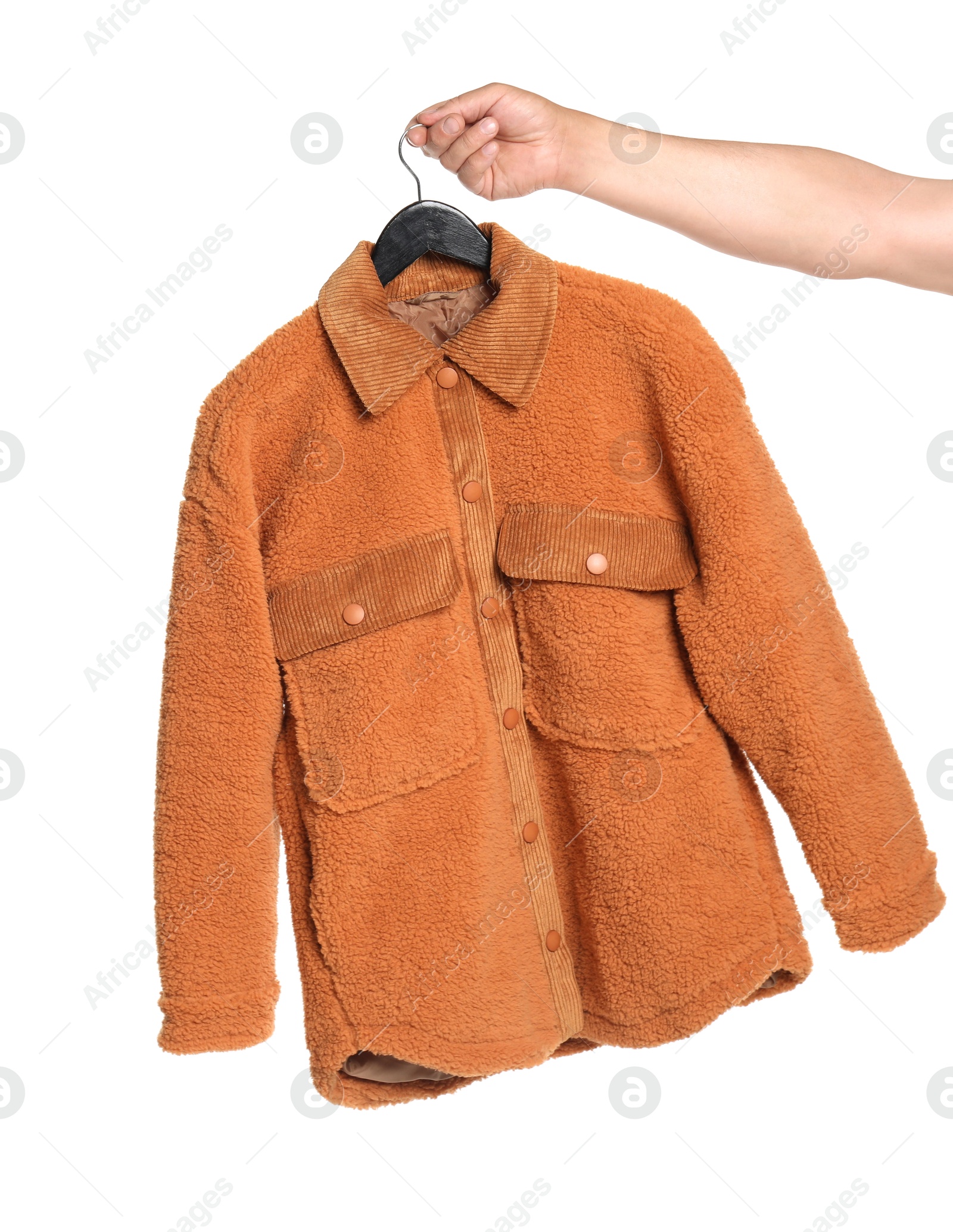 Photo of Woman holding hanger with brown jacket on white background, closeup